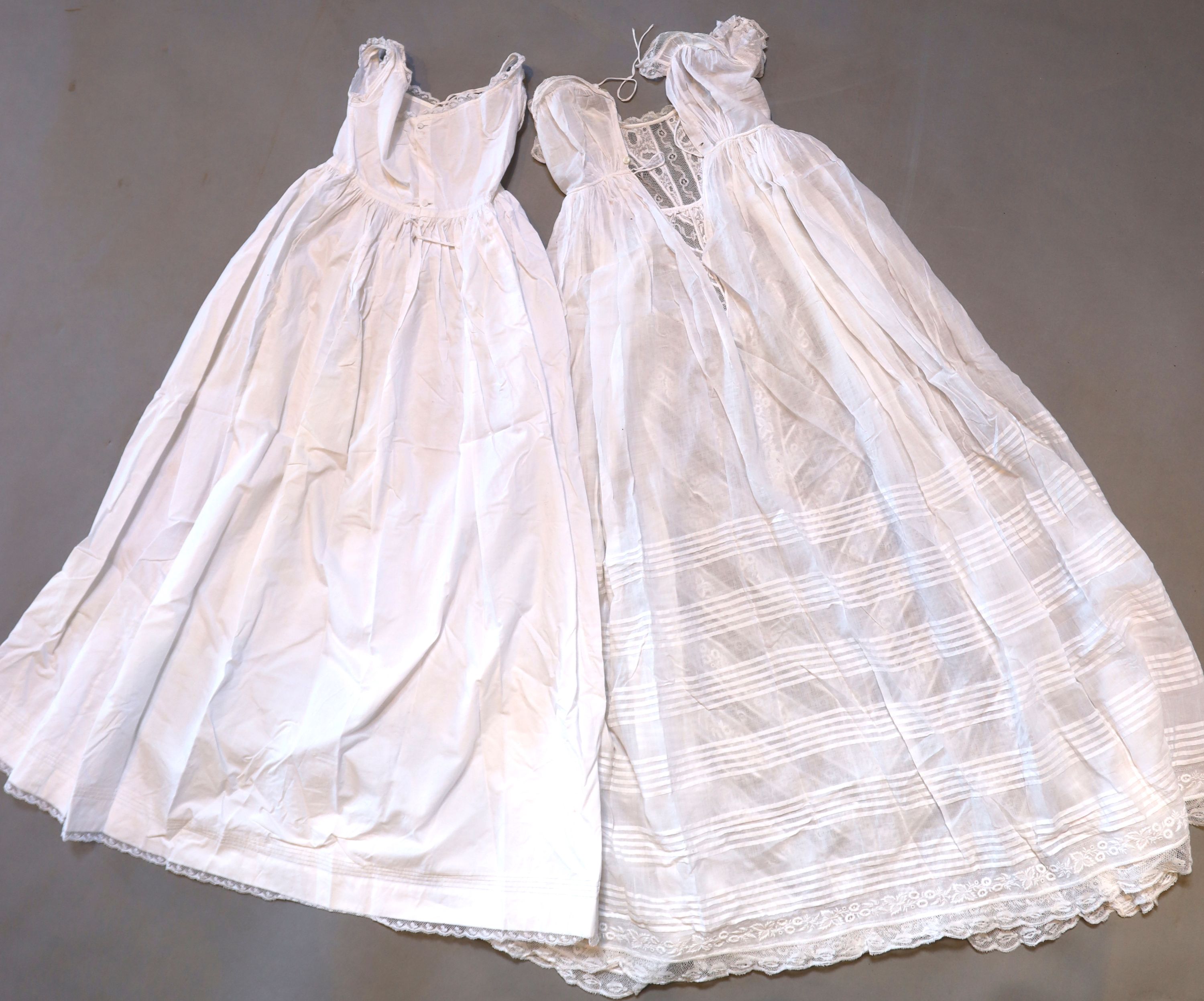 A collection of embroidered whitework christening robes